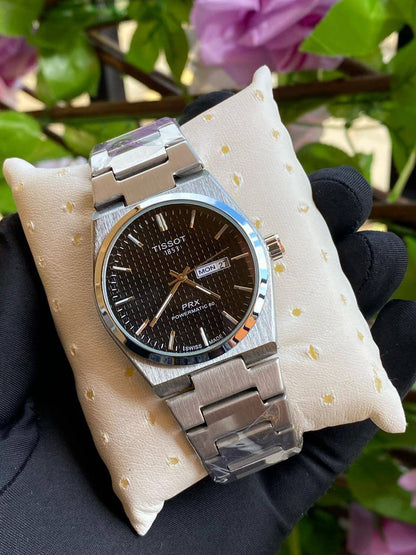 TISSOT DAY & DATE BATTERY POWERED WATER RESISTANT DAY & DATE DISPLAY STAINLESS STEEL FINISH ENQUIRIES