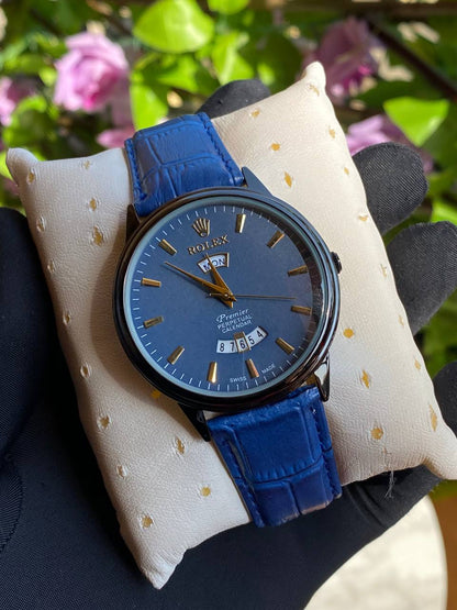 LEATHER DAY&DATE GENTS WATCH DAY&DATE DISPLAY WATER RESISTANT FINELY POLISHED LEATHER STRAP STAINLESS STEEL CASE ENQUIRIES