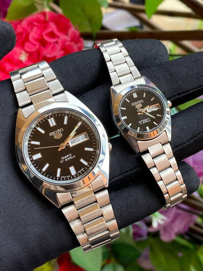 SEIKO 5 SINGLE PAIR DAY AND DATE DISPLAY BATTERY POWERED NON FADE STAINLESS STEEL FINISH NIGHT GLOW ENQUIRIES