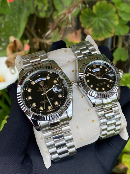 ROLEX COUPLE WATCHES SINGLE PIECE DAY AND DATE DISPLAY WATER RESISTANT BATTERY POWERED ENQUIRIES