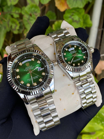 ROLEX COUPLE WATCHES SINGLE PIECE DAY AND DATE DISPLAY WATER RESISTANT BATTERY POWERED ENQUIRIES