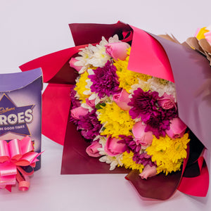 Pink Rose Flowers, Mixed Chrysanthemums and Cadbury Heroes Chocolates