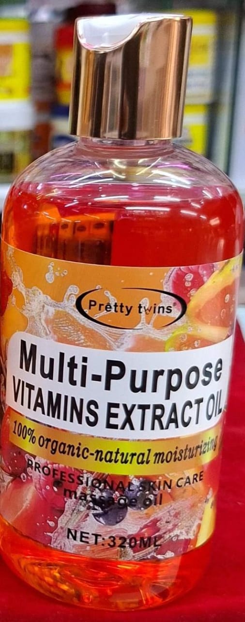 Multifunctional vitamins extract oil bottle with colorful label on a blurred background