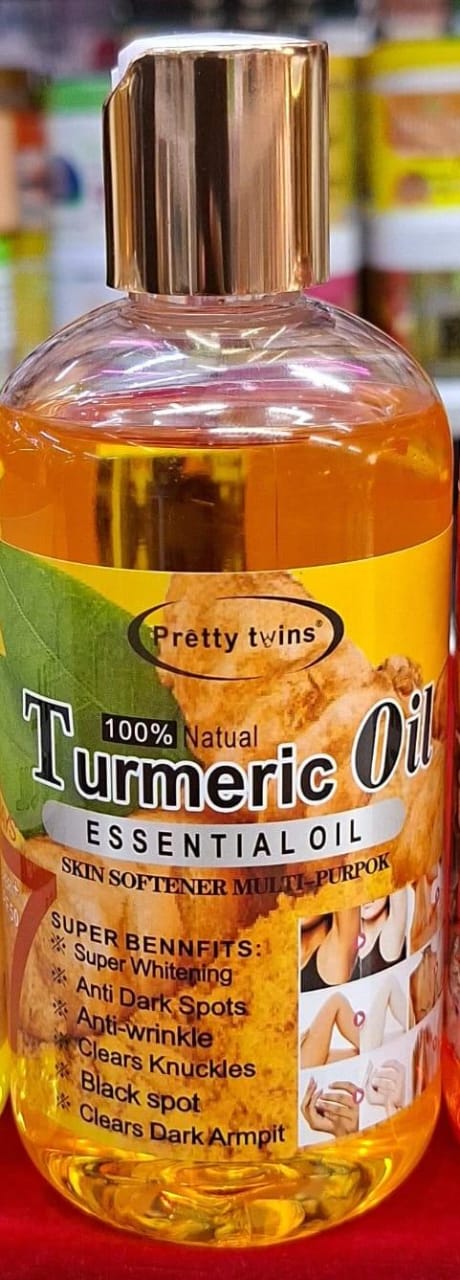 Turmeric oil bottle with branding and product details on a red background