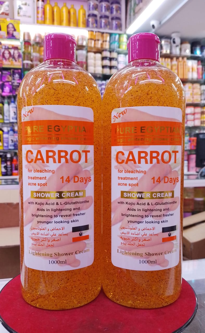 Two bottles of Carrot Shower Cream on a red surface with a store shelf in the background.