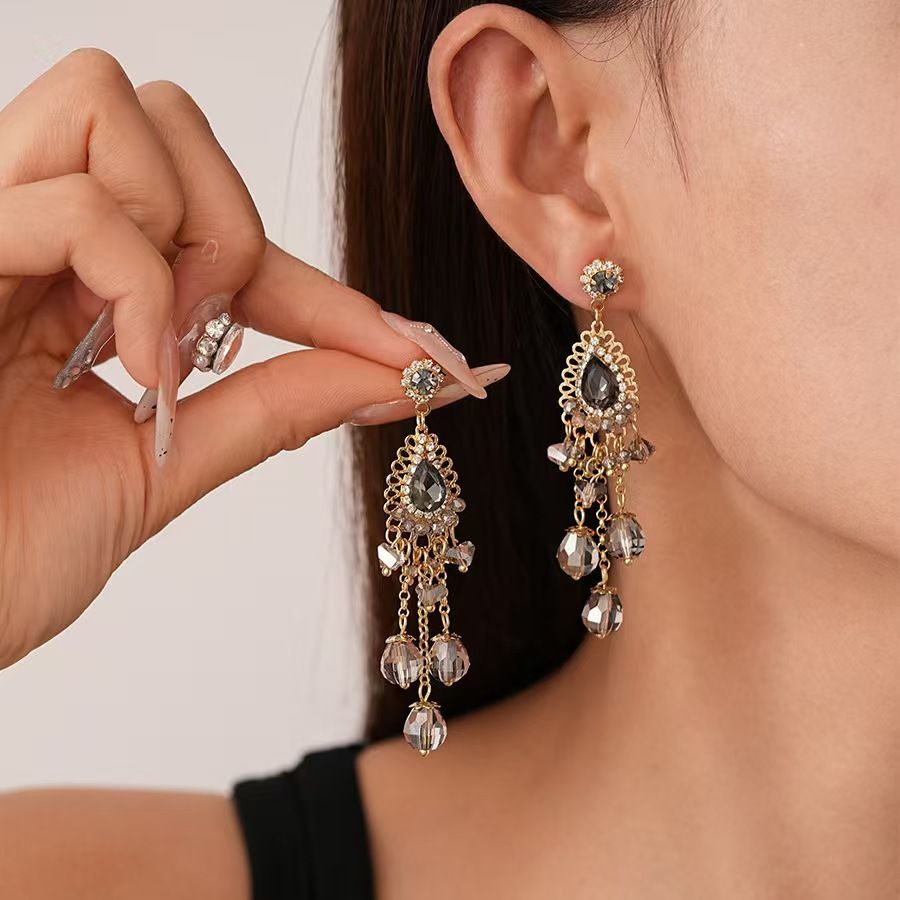 Vintage high-end silver needle ethnic style diamond inlaid flower earrings with exaggerated European and American temperament earrings pendant light luxury niche earrings