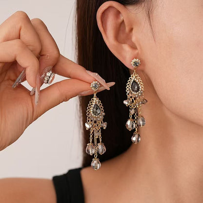 Vintage high-end silver needle ethnic style diamond inlaid flower earrings with exaggerated European and American temperament earrings pendant light luxury niche earrings