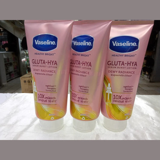 Three tubes of Vaseline Healthy Bright Gluta-Hya lotion on a white surface.