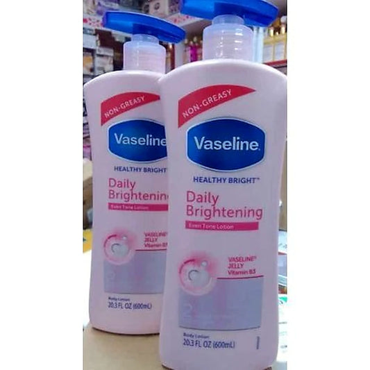 Two bottles of Vaseline Healthy Bright Daily Brightening lotion on a white background