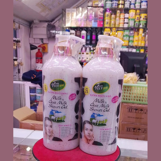Two bottles of VeeGee Extra Whitening Milk & Goat Milk Shower Gel on a red platform with a store shelf in the background.