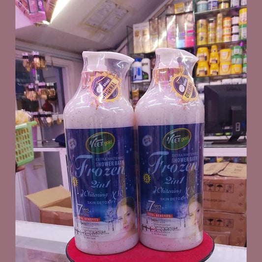Two bottles of 'Frozen 2in1' shower bath product on a red stand with a store interior background.