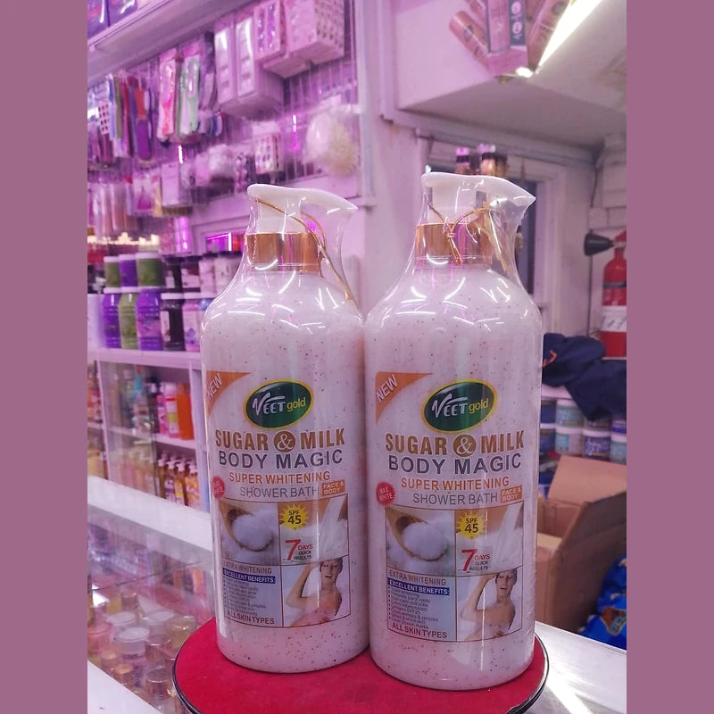 Two bottles of 'Sugar & Milk Body Magic' product on a shelf in a store.