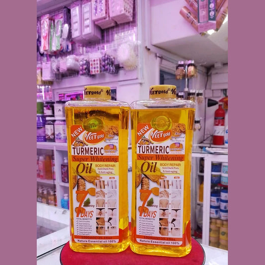 Two bottles of 'New Veet Gold Turmeric Super Whitening Oil' on a red stand with a store shelf in the background.