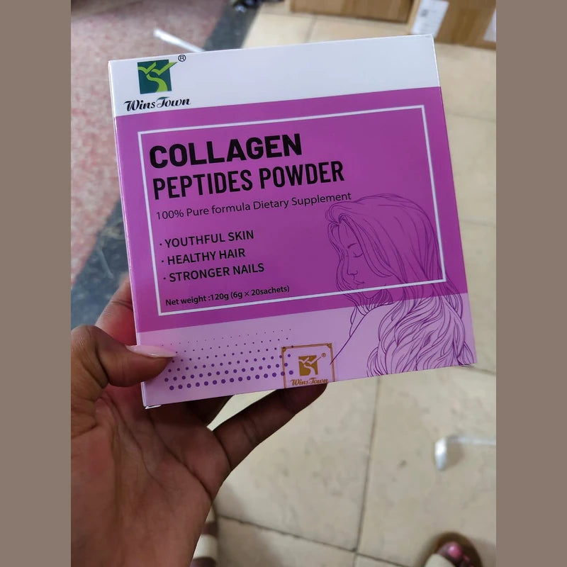 Collagen peptides powder package held by a hand on a tiled floor background