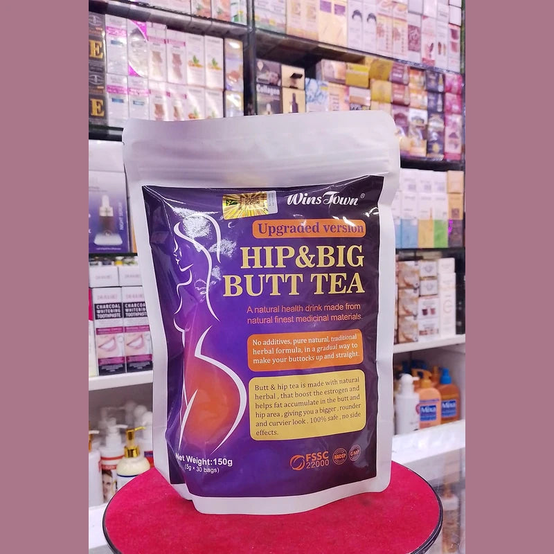 Package of 'Hip & Big Butt Tea' on a red stand with a store shelf in the background