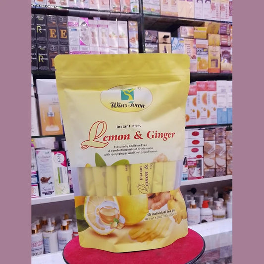 Packaged lemon and ginger drink mix on a red stand with shelves of products in the background