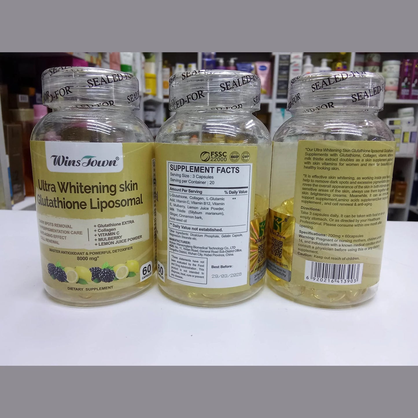 Three bottles of Wiss Town Ultra Whitening skin Glutathione Liposomal supplement on a white surface.