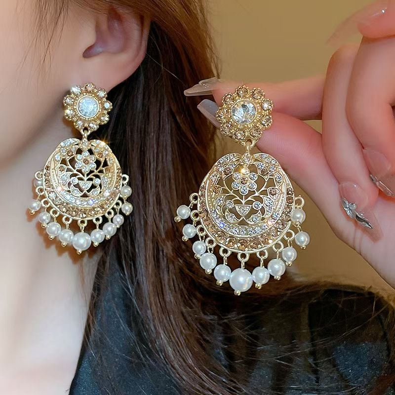 Vintage high-end silver needle ethnic style diamond inlaid flower earrings with exaggerated European and American temperament earrings pendant light luxury niche earrings