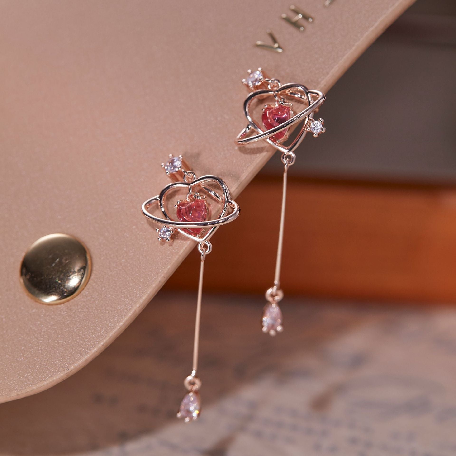 Long love-heart earrings and ear studs for women. They have a light luxury and elegant temperament.